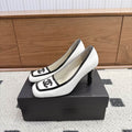 Chanel White Pumps with Black Trim