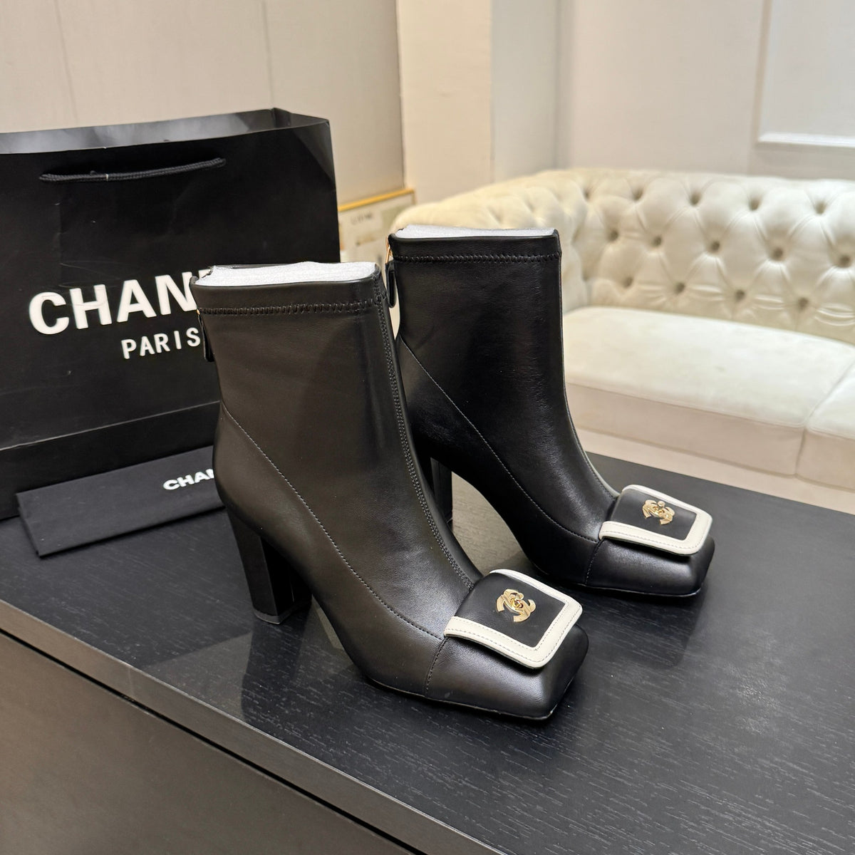 Chanel Black Ankle Boots with Gold-Tone Emblem